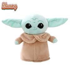 Cute Baby Alien Plushie with large ears, oversized eyes, and tan robe on white background